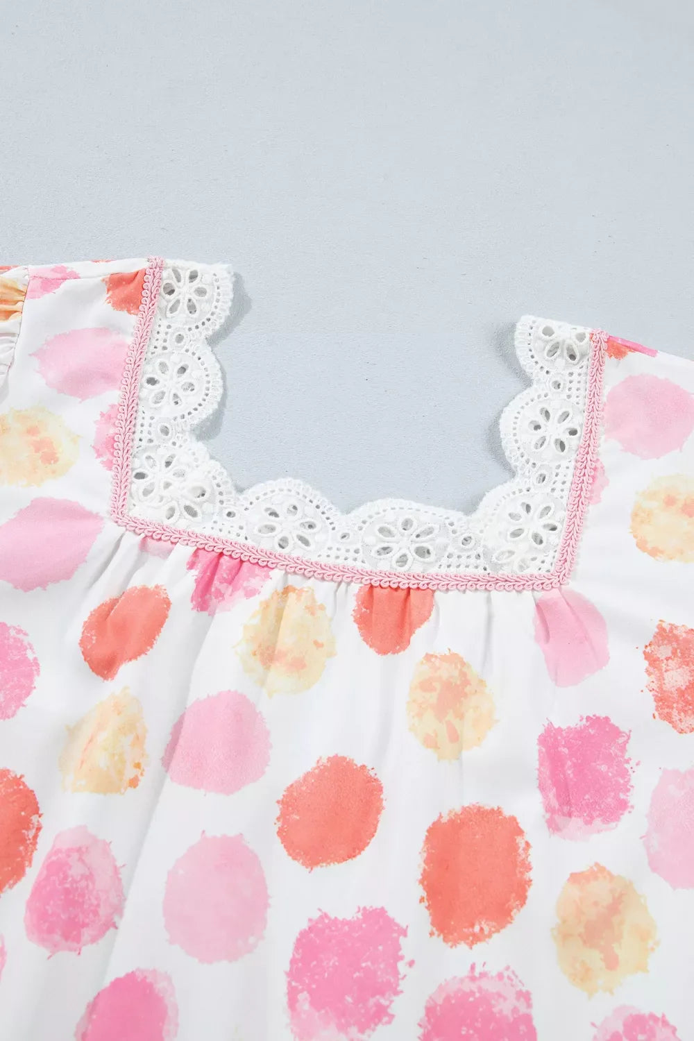 Polka dot lace trim square neck puff sleeve blouse by Plush Fashion Hub, featuring a feminine design with ruffled sleeves and delicate lace details.