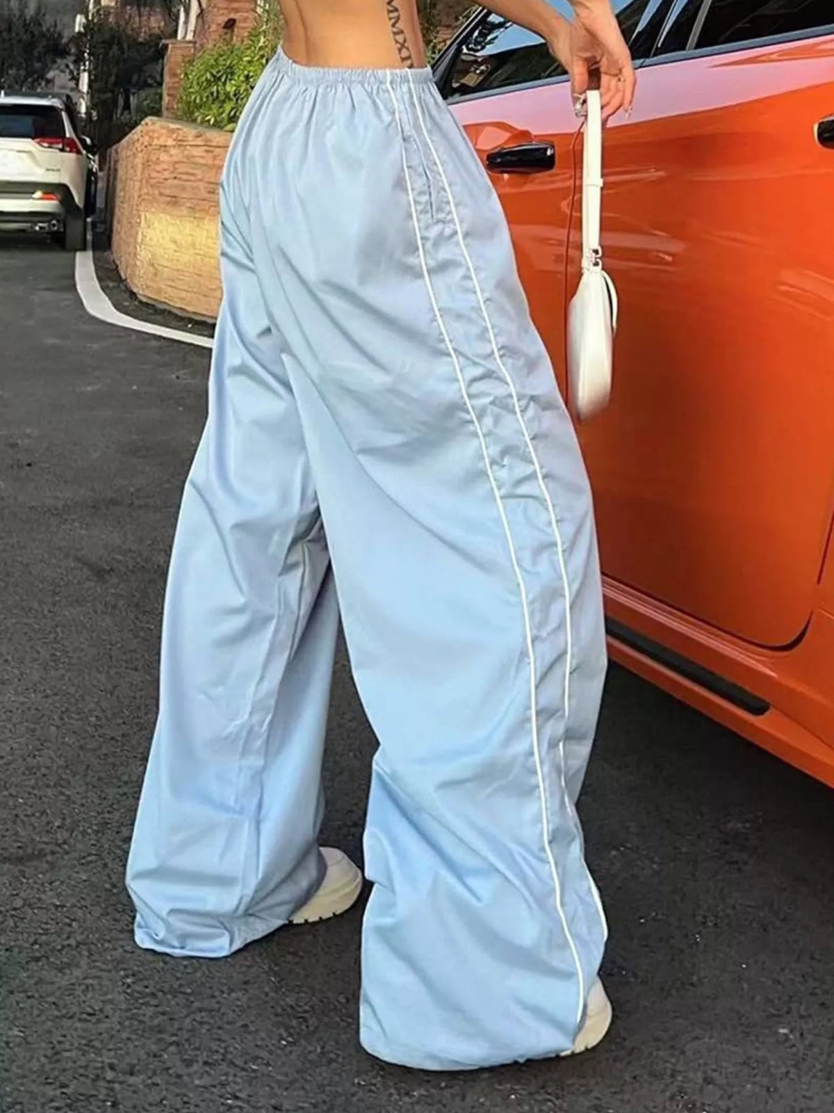 Women's lightweight high-rise wide-leg pants with elastic waist, plush fashion style, shown as a casual dress in natural fabric.
