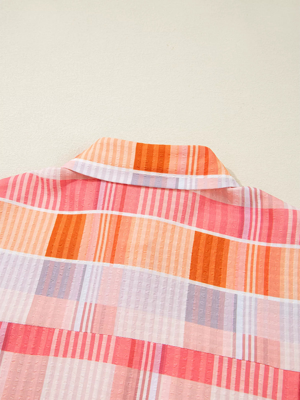 Oversized check tunic shirt for women featuring a relaxed fit and classic plaid pattern, stylishly worn as casual women's fashion.