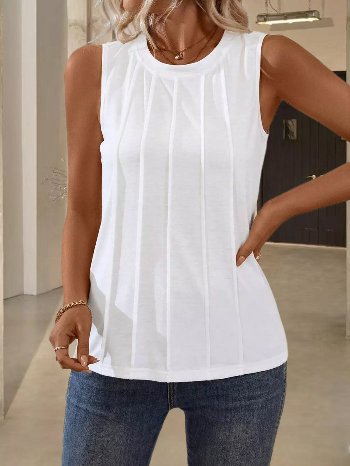 Plush Fashion Hub round neck tank top in soft fabric, featuring a simple, stylish design as shown in the image.