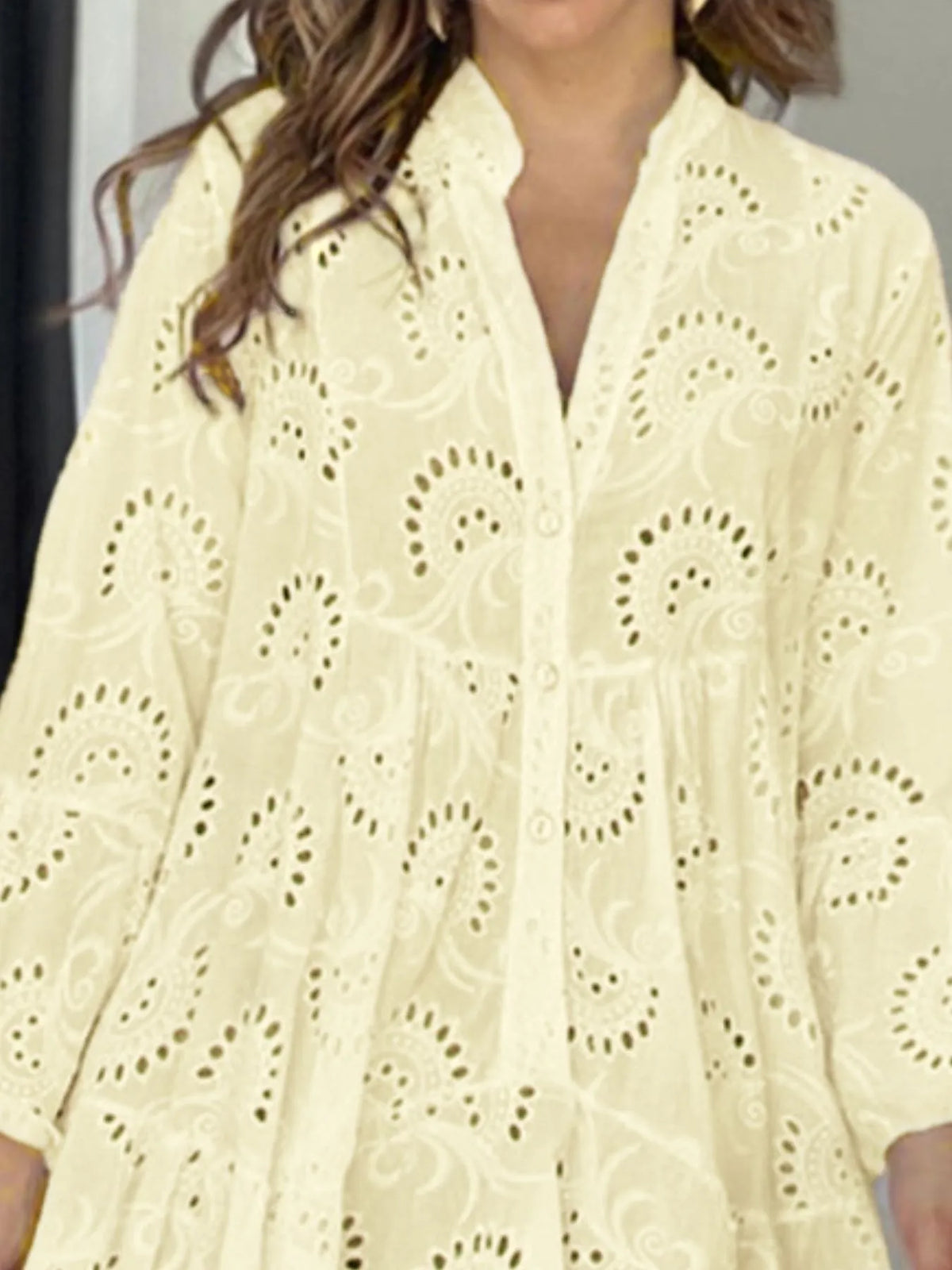 Plus size full-length eyelet ruffled hem tiered dress by Trendsi, featuring a flowy design and tiered layers with eyelet details.