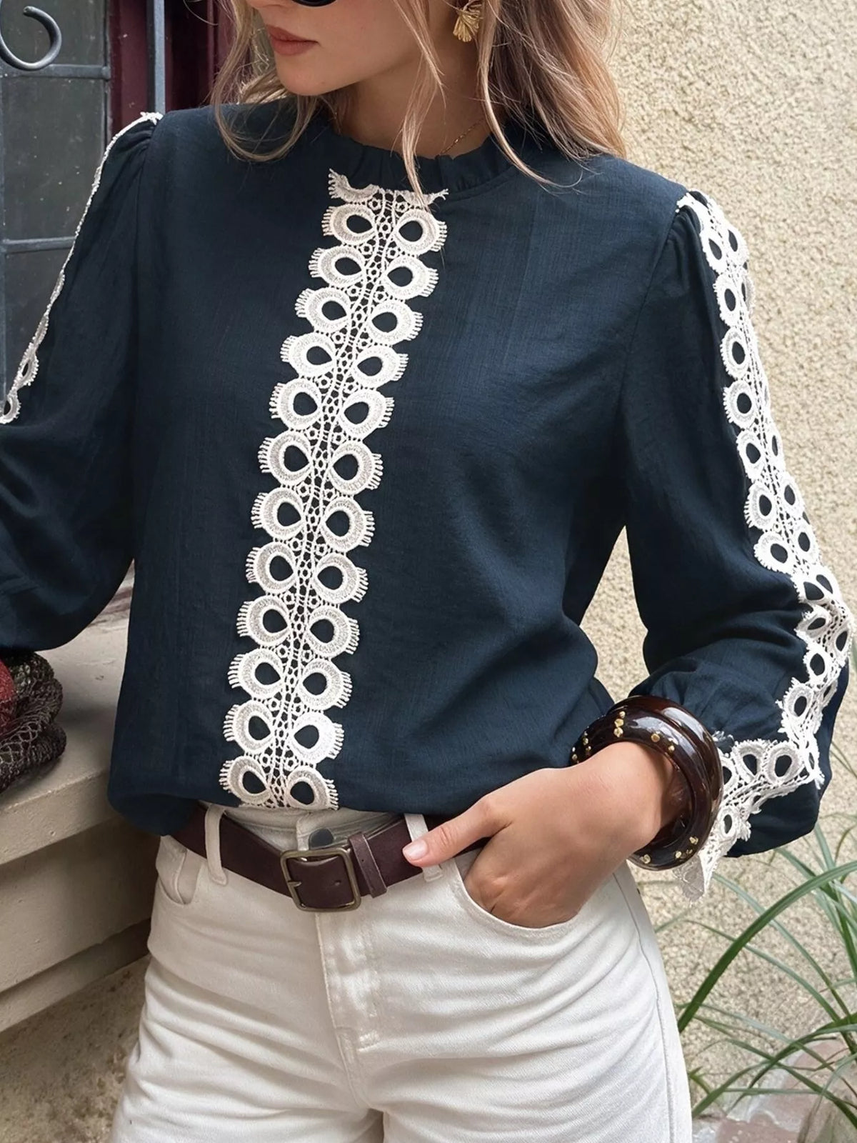Lace trim long sleeves blouse from Trendsi featuring delicate lace details and a stylish, elegant design.