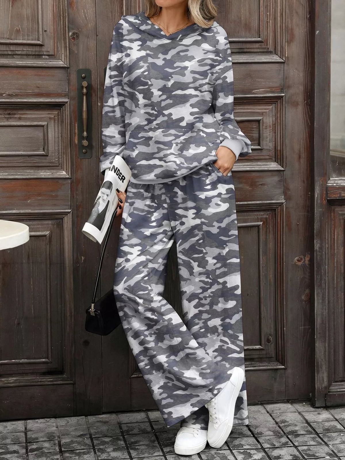 Printed long sleeve hoodie and pants set by Trendsi, featuring a comfortable, stylish design with matching top and bottom in a vibrant pattern.