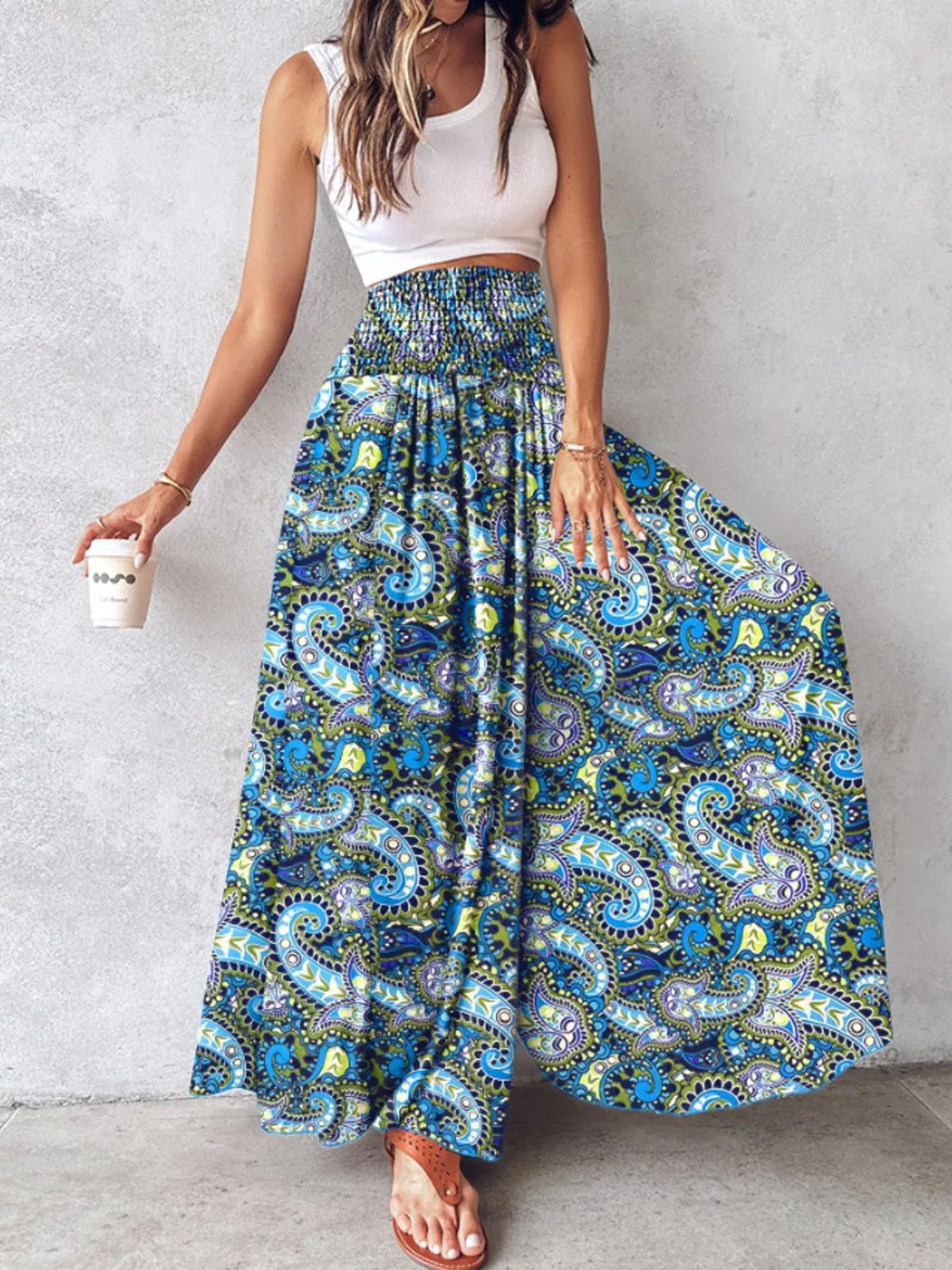 Printed wide-leg pants by Plush Fashion Hub, featuring a colorful floral pattern and relaxed fit, displayed on a model.