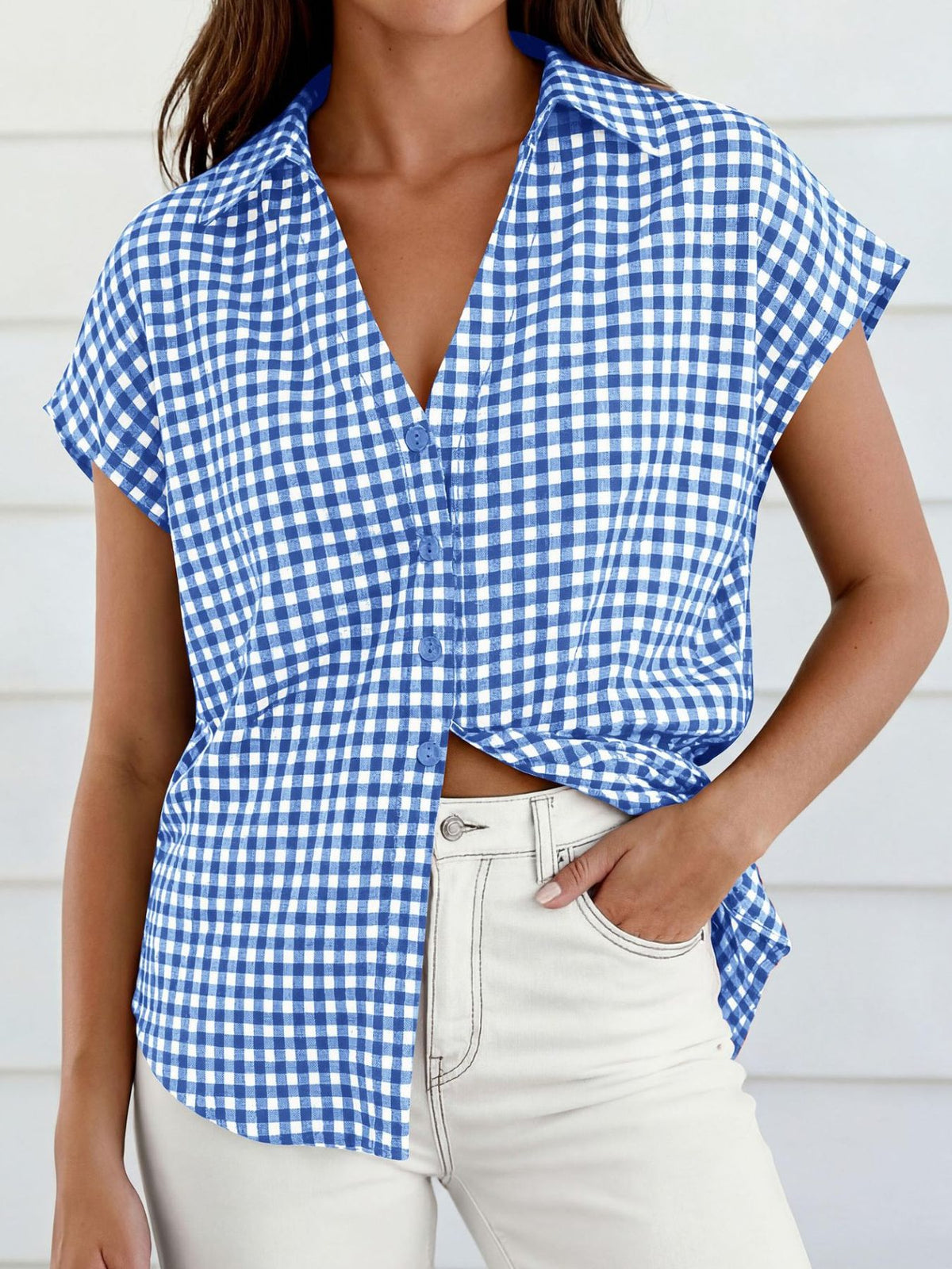 Women's gingham print button-down shirt with tie detail from Plush Fashion Hub, featuring a classic style and collared neckline.