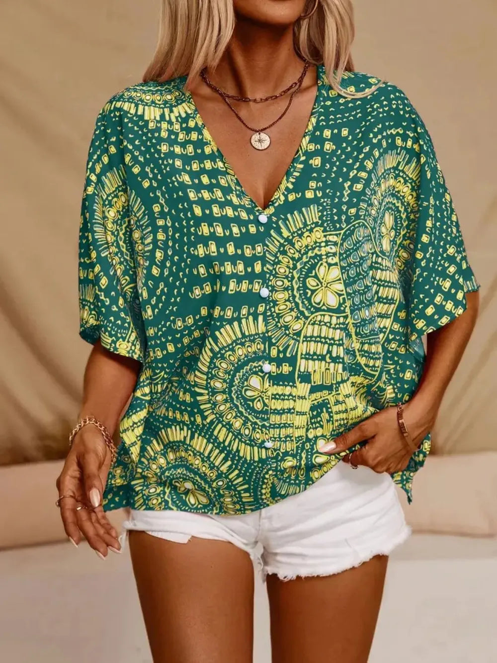 Women's printed V-neck half sleeve blouse by Plush Fashion Hub, soft stretch casual office top with floral pattern.