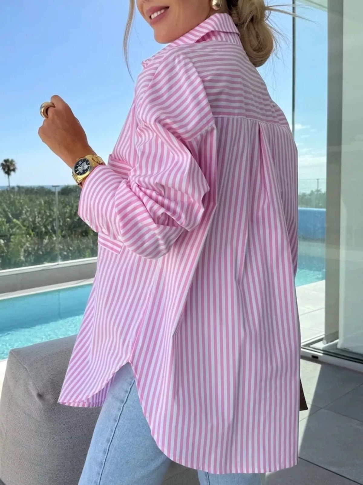 Women's long sleeve button-up striped shirt by Trendsi, featuring a classic design with vertical blue and white stripes.