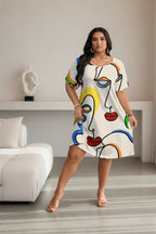 Women’s casual printed round neck short sleeve dress by FitiqueFit, featuring a relaxed fit and vibrant floral pattern.