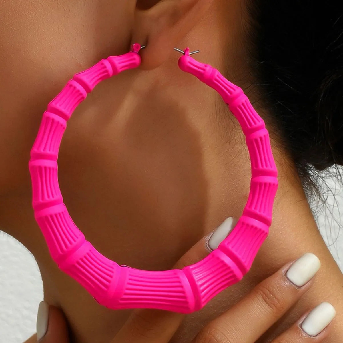 Stainless steel textured hoop earrings with a polished finish, perfect for casual or formal wear.