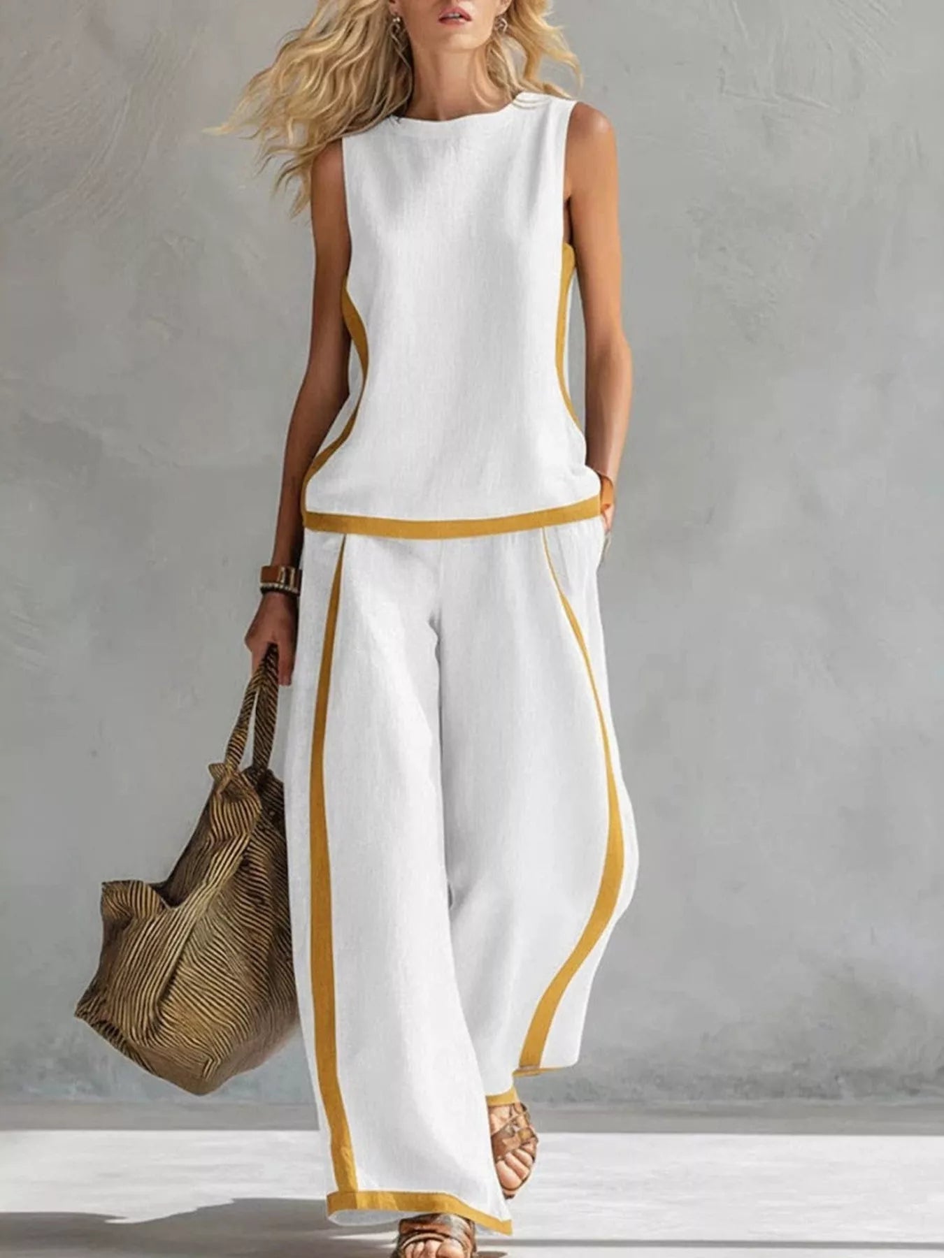 Plus size contrast stripe sleeveless top and wide-leg pants set by Trendsi, showcasing a stylish modern fashion ensemble.
