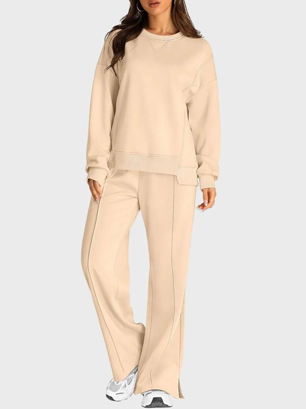 Trendsi round neck long sleeve top and slit pants set, stylish matching outfit, casual wear, in neutral tones.