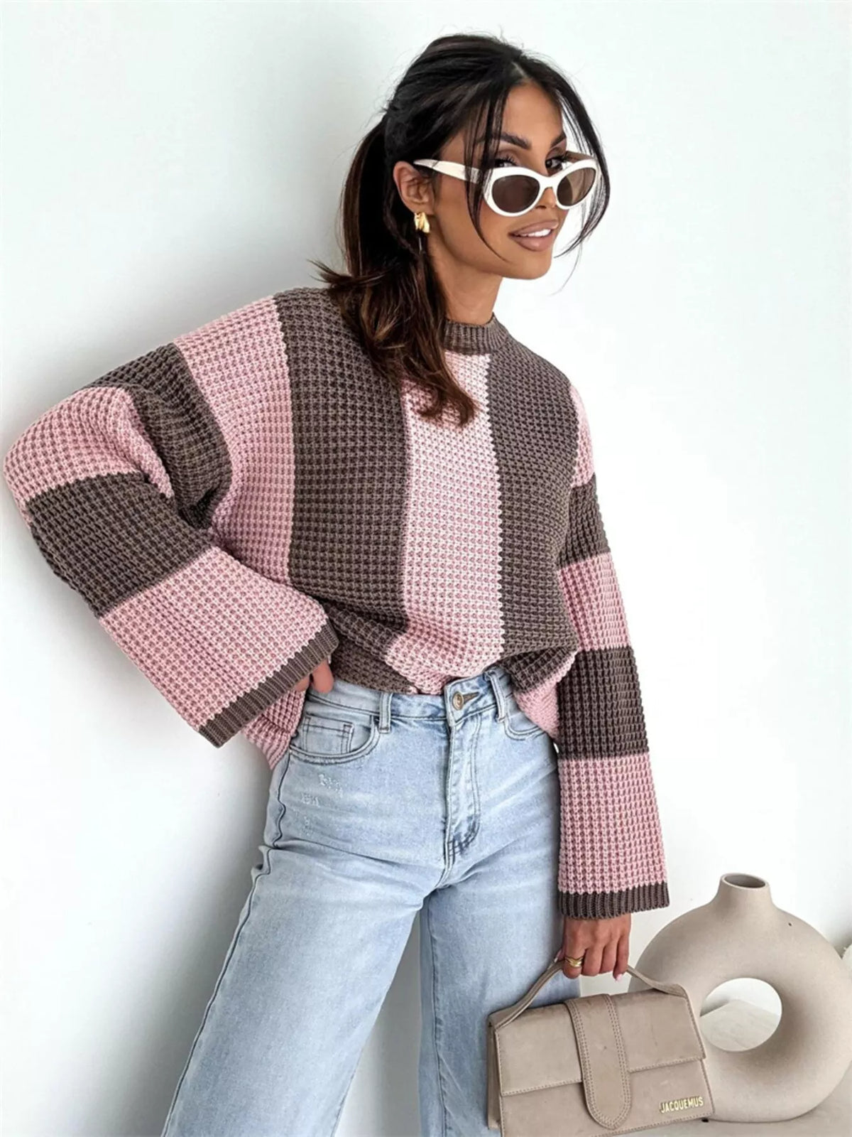 Color block long sleeve sweater by Trendsi featuring vibrant multi-colored panels and a comfortable knit design.