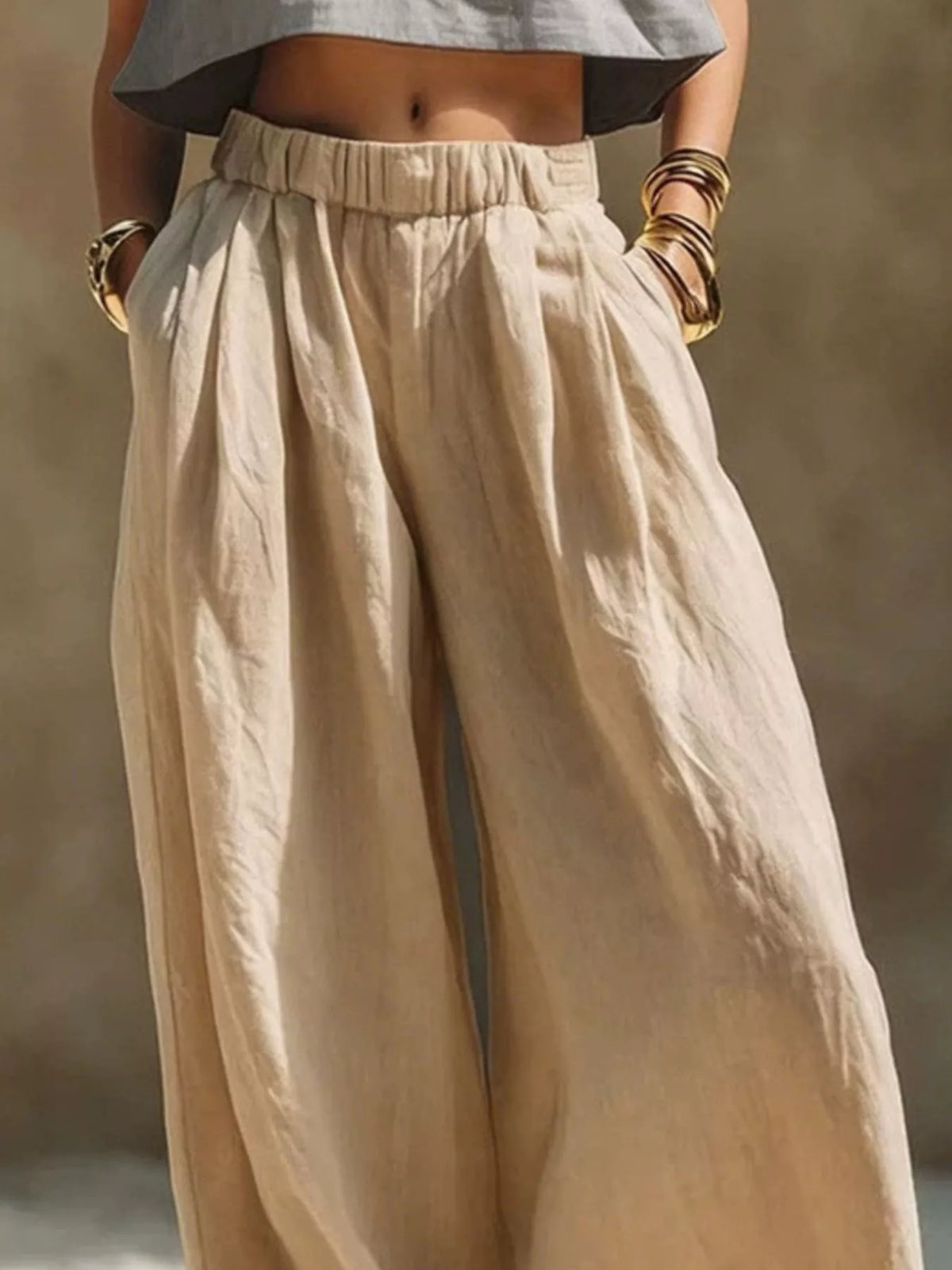 Plus size wide leg pants with full elastic waistband, flowing fabric, and relaxed fit, ideal for comfortable stylish wear.