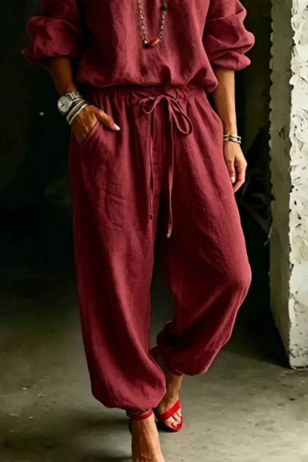 Plus size off-shoulder top and pants set by Trendsi, featuring a stylish, coordinated full-size outfit with a relaxed fit.