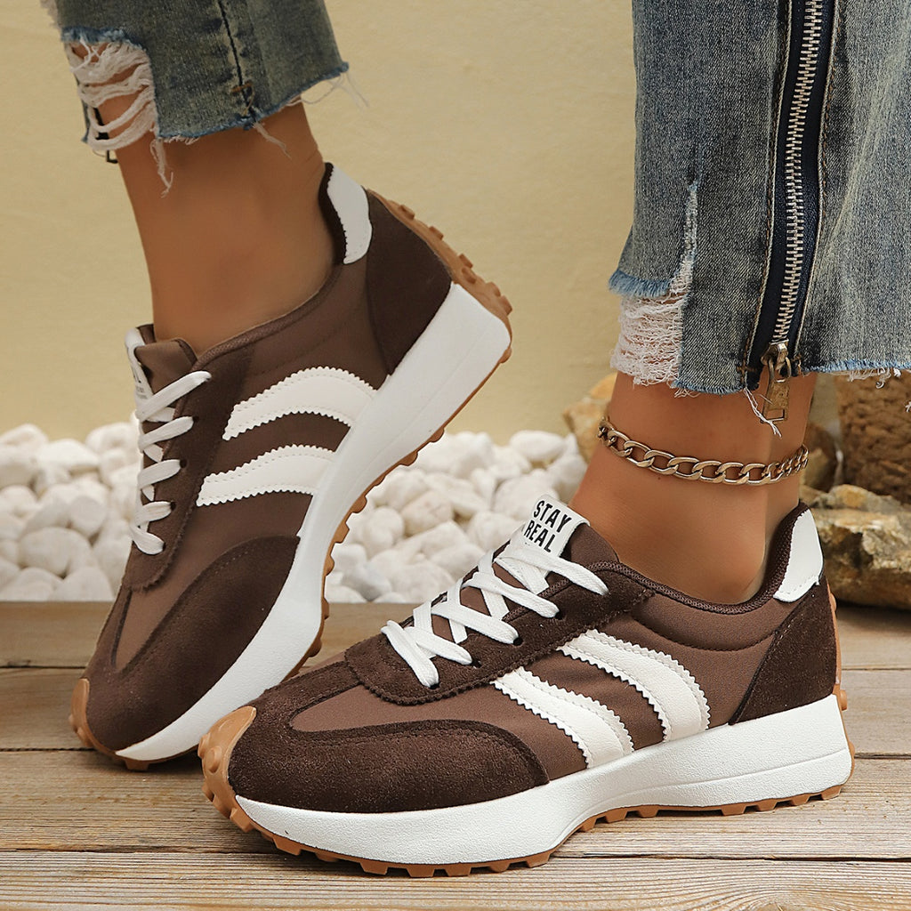 Women's round toe lace-up casual sneakers by Trendsi featuring comfortable PU leather, flat design, and stylish everyday footwear.