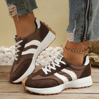 Women's round toe lace-up casual sneakers by Trendsi featuring comfortable PU leather, flat design, and stylish everyday footwear.