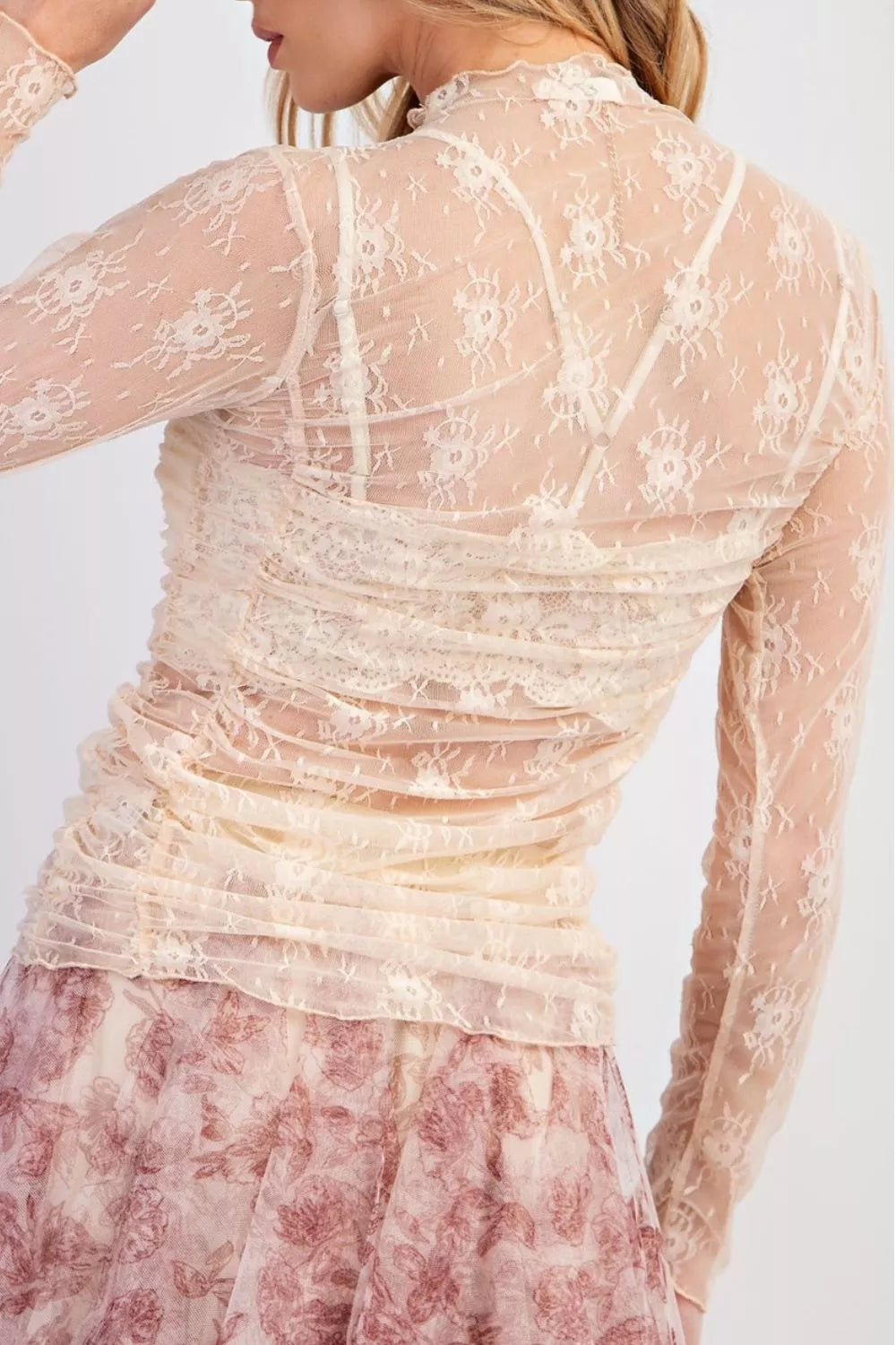 Sheer floral mesh long sleeve ruched top by Plush Fashion Hub, showcasing delicate floral pattern and fitted style.