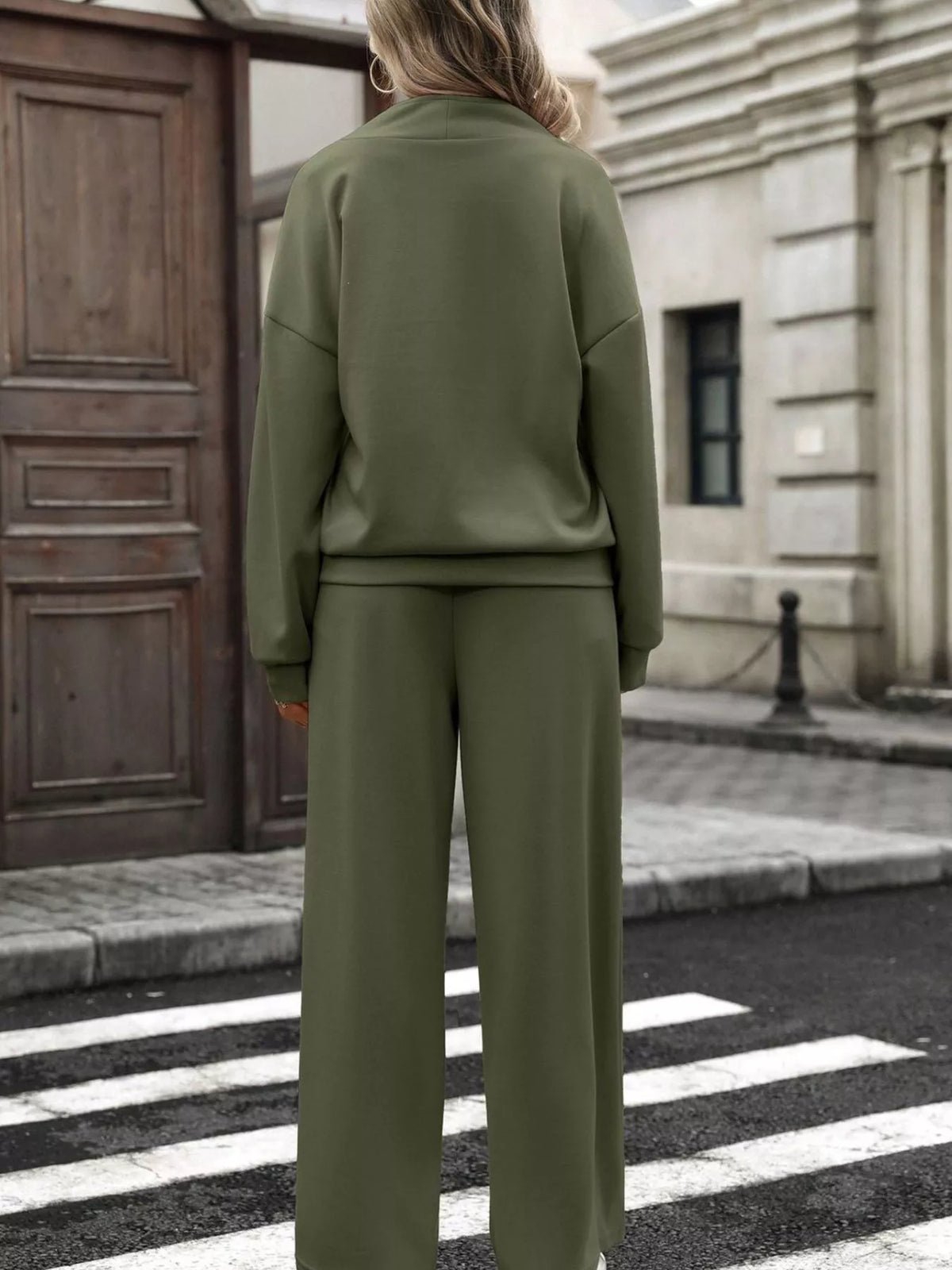Women’s half zip sweatshirt and wide-leg pants set by Trendsi, featuring a cozy sweatshirt and flowy pants in neutral tones.