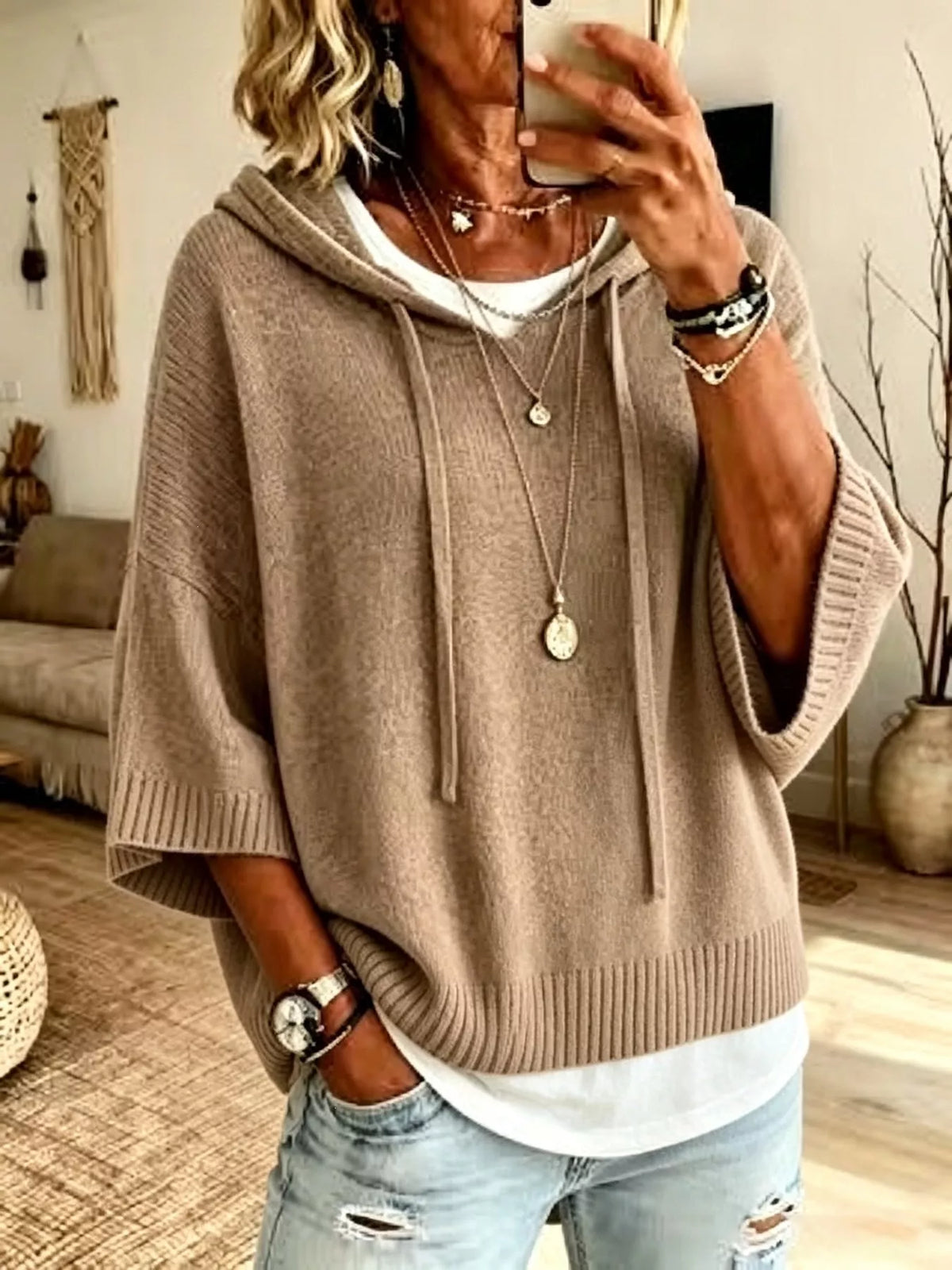 Full size plus 3/4 sleeve hooded sweater by Trendsi with drawstring, featuring a cozy, casual design in soft fabric.
