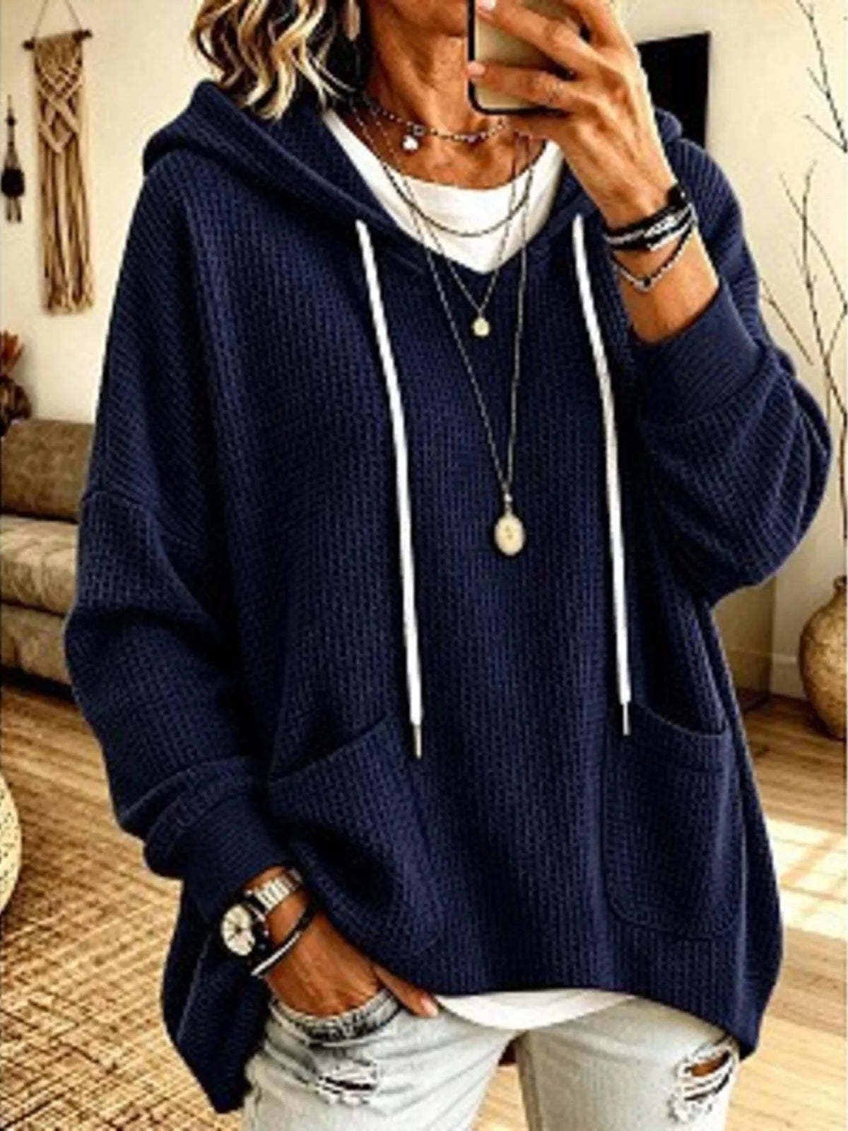 Plus size women's waffle knit hoodie with pockets, casual full-size hoodie from Trendsi, showing front view and cozy fabric detail.