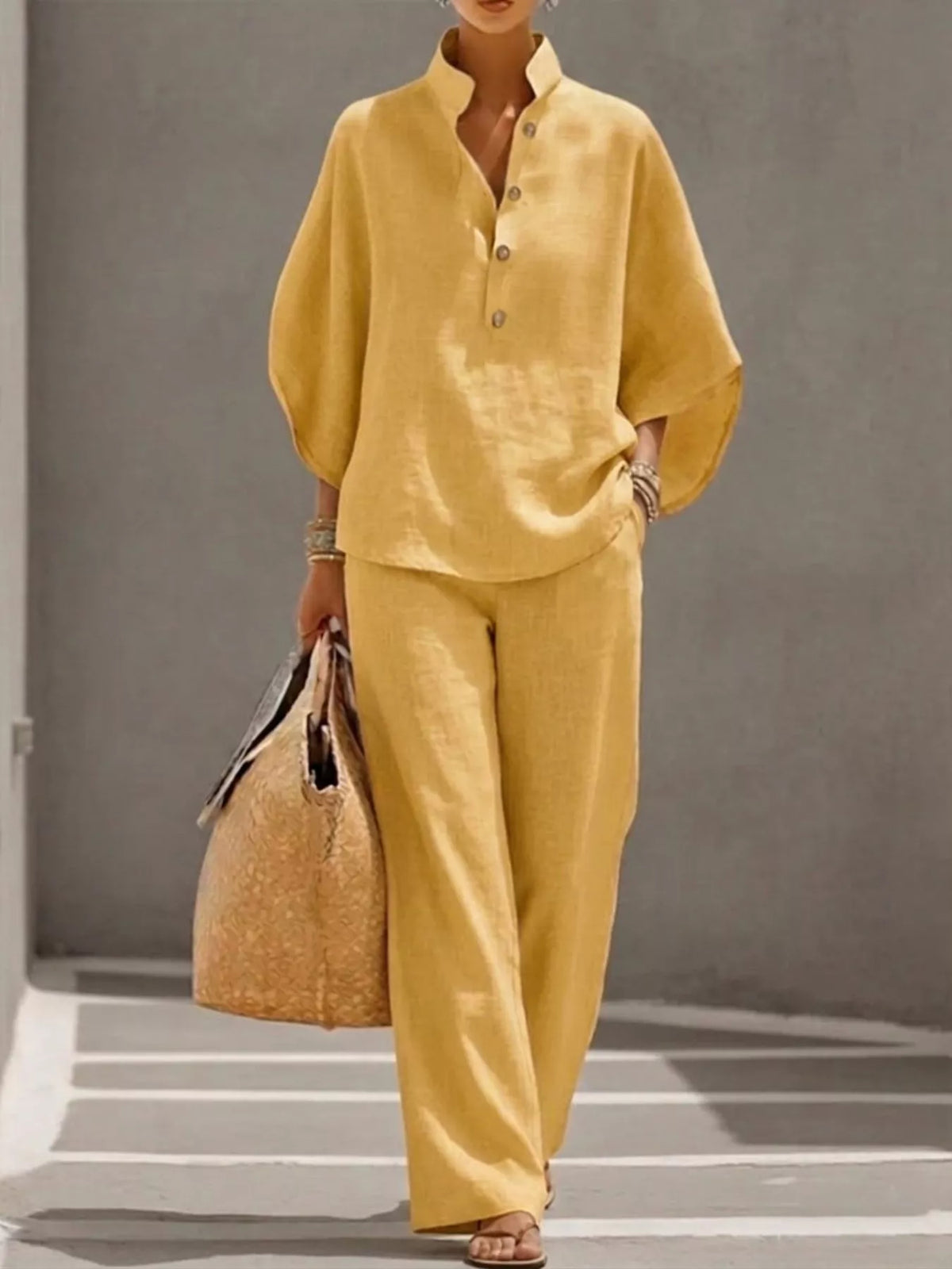 Plus size women's two-piece dress set with button-detail 3/4 sleeve top and matching pants by Plush Fashion Hub.