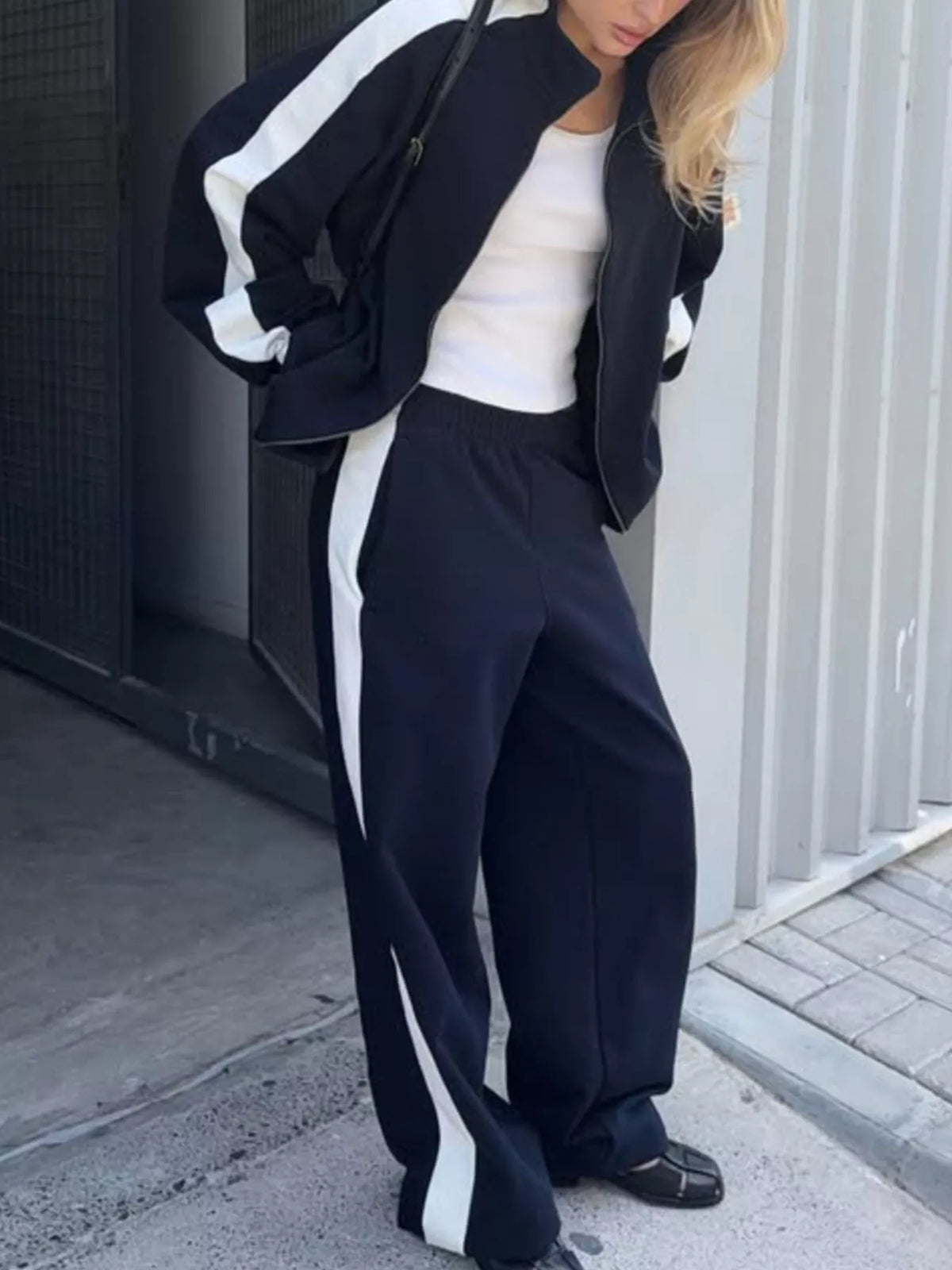 Plush Fashion Hub zip-up long sleeve tracksuit set, soft fabric, featuring a jacket and matching pants in a stylish design.