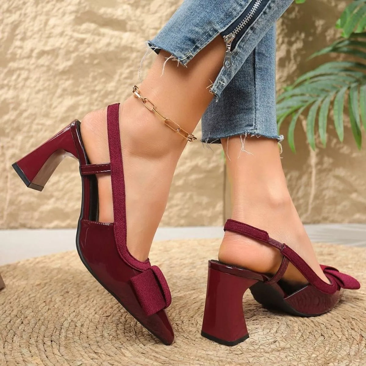 Point toe block heels slingback sandals in black leather, stylish footwear by Trendsi featuring a sleek silhouette and slingback strap.