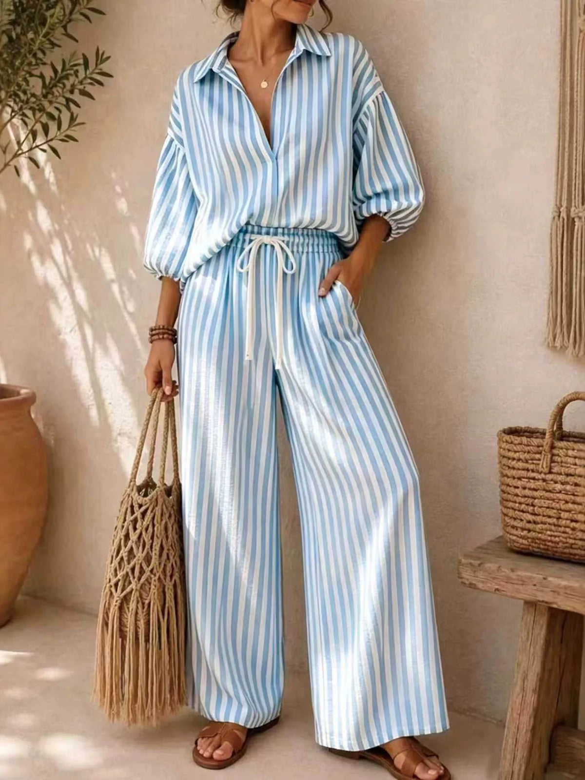 Plus size striped puff sleeve shirt and wide-leg drawstring pants set by Trendsi, stylish matching outfit for casual wear.
