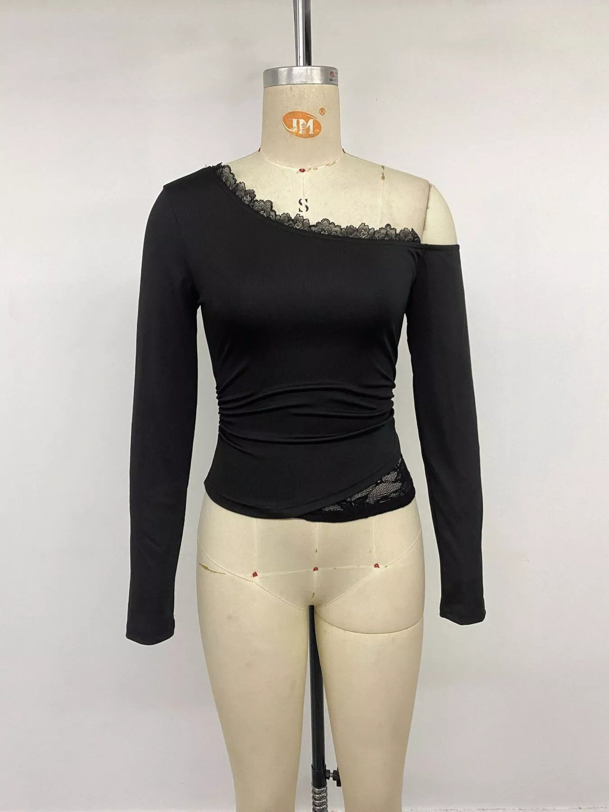 One-shoulder lace trim slim fit T-shirt by Trendsi, featuring a stylish asymmetrical design and delicate lace detail.