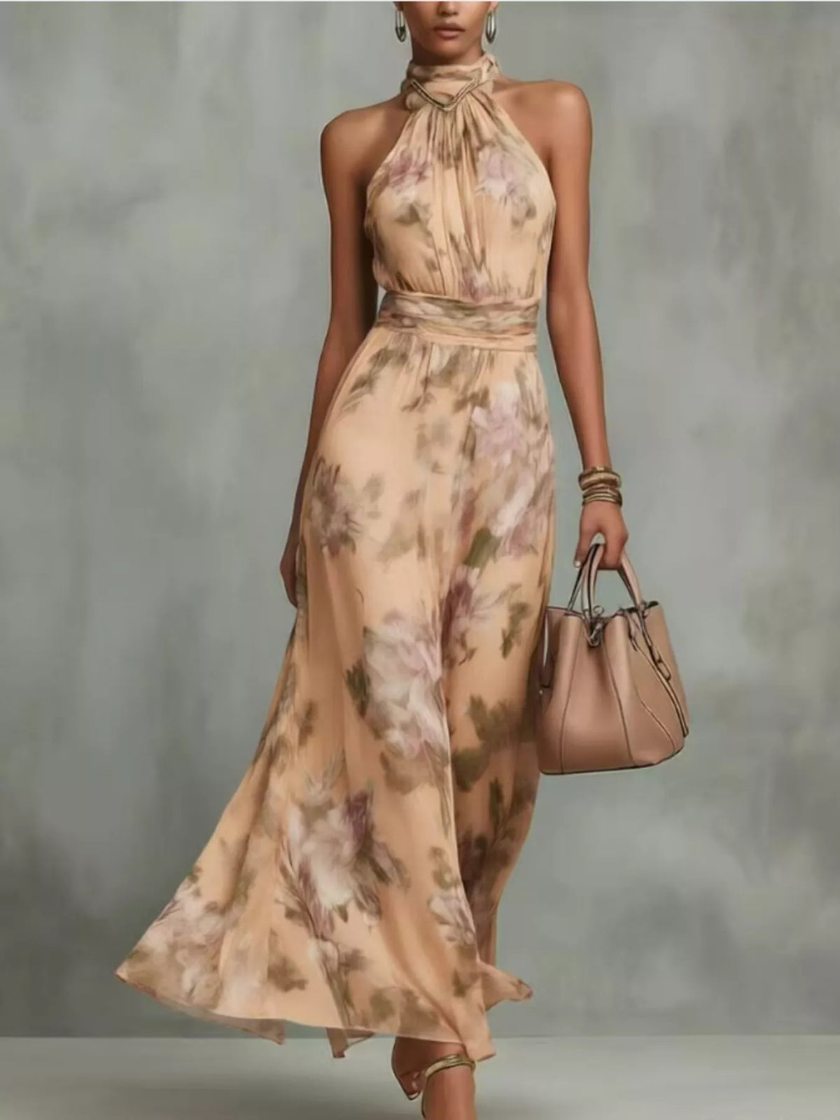Plus size floral print sleeveless maxi dress by Trendsi, featuring a flowing full-length design with vibrant floral patterns.