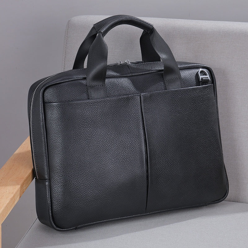 Genuine leather Pi-Mart men's large capacity briefcase with cowhide construction, horizontal design, and computer storage compartment.