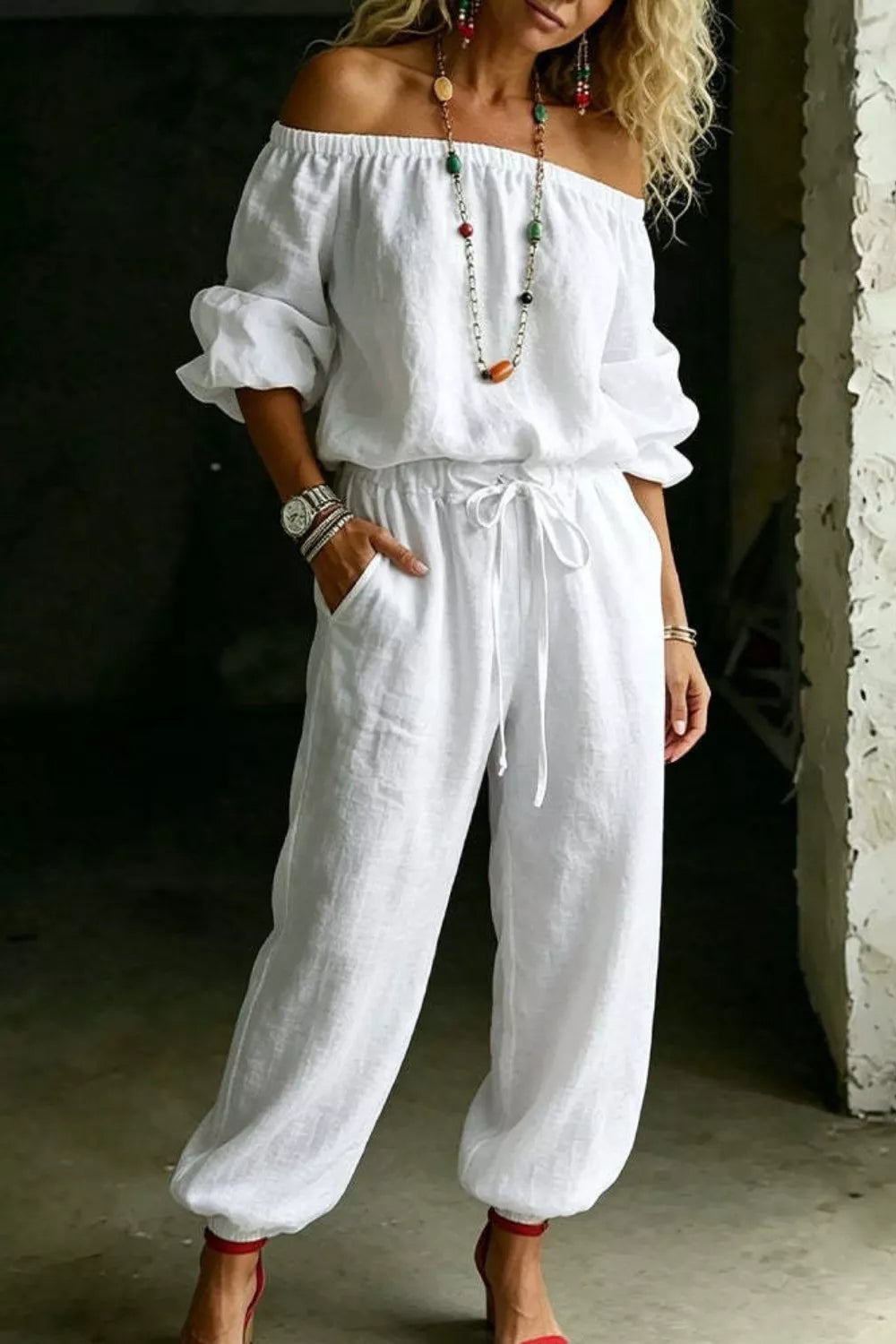 Plus size off-shoulder top and pants set by Trendsi, stylish full-size matching outfit with a trendy off-shoulder design.