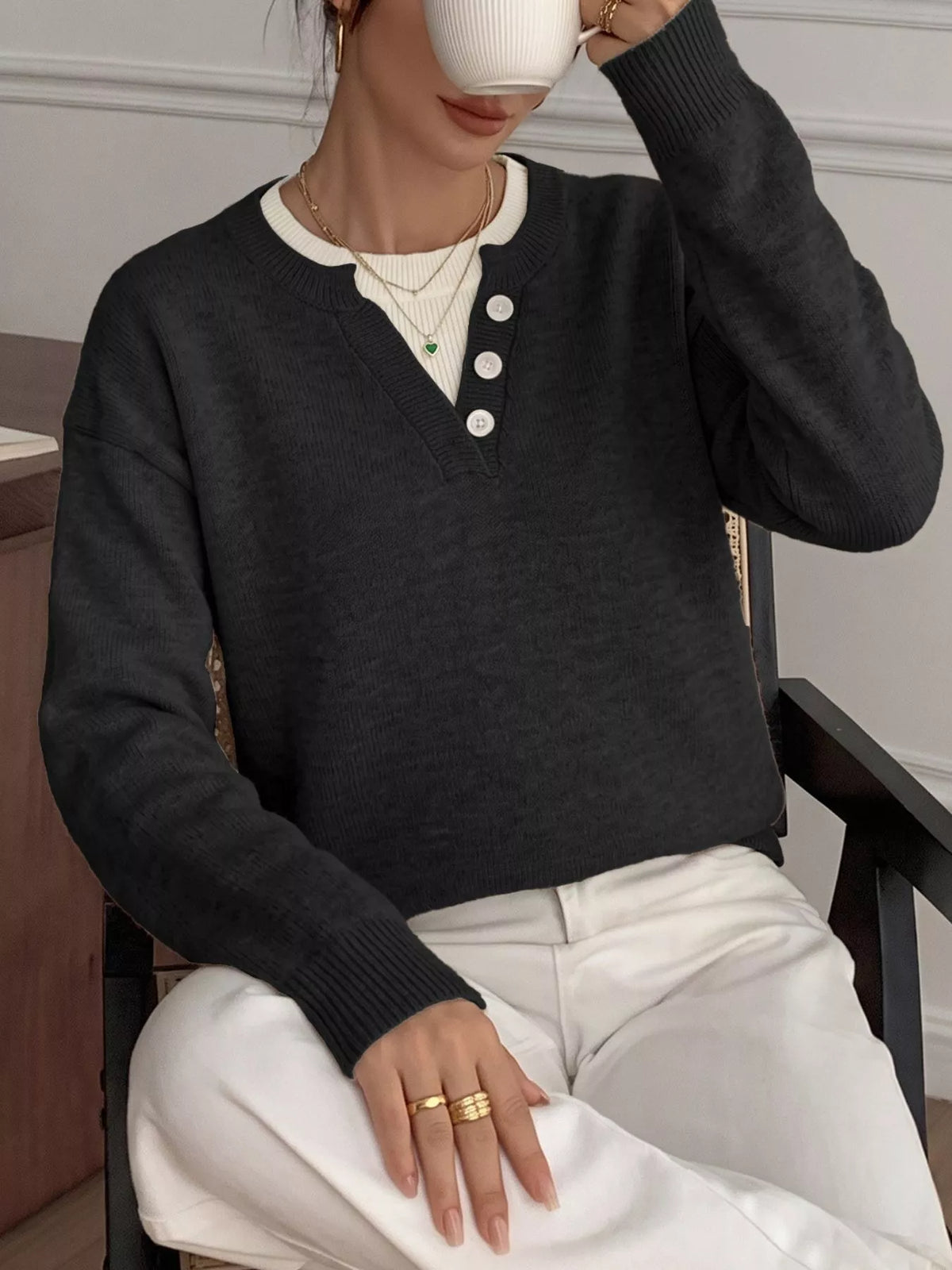 Ribbed knit sweater with button-placket detail from Trendsi, featuring a close-up of the textured fabric and button accents.