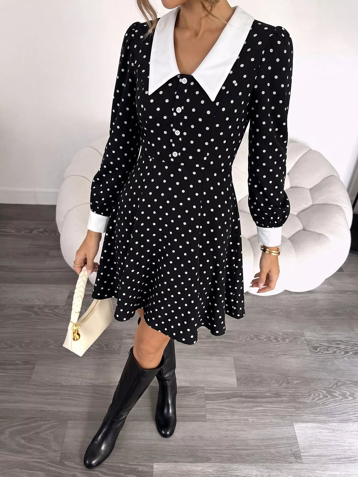 Polka dot Peter Pan collar dress by Plush Fashion Hub featuring a classic style and playful pattern, shown on a hanger.