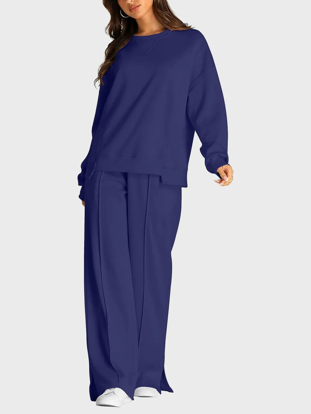 Trendsi round neck long sleeve top with slit pants set, featuring a coordinated matching design in a stylish, casual look.