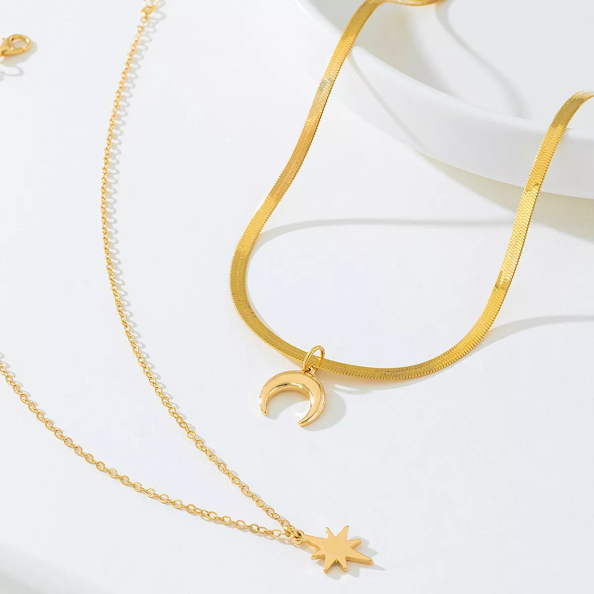Gold-plated moon and star necklace set with two matching pieces, stylish jewelry from Plush Fashion Hub.