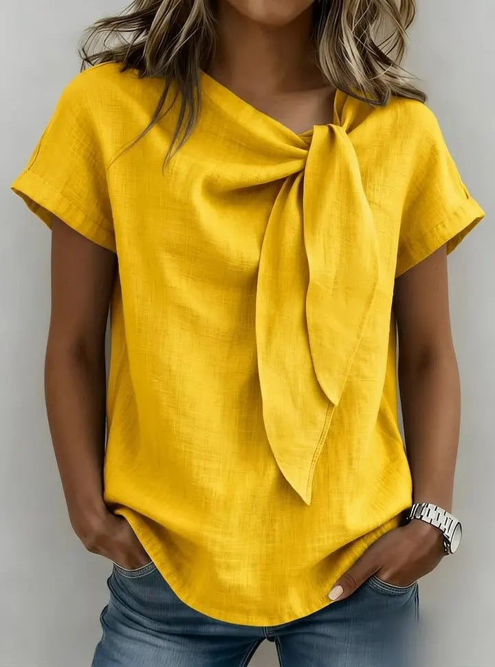 Women's loose-fit short sleeve casual pullover T-shirt by FitiqueFit, shown in a relaxed fit with a crew neckline and soft fabric.