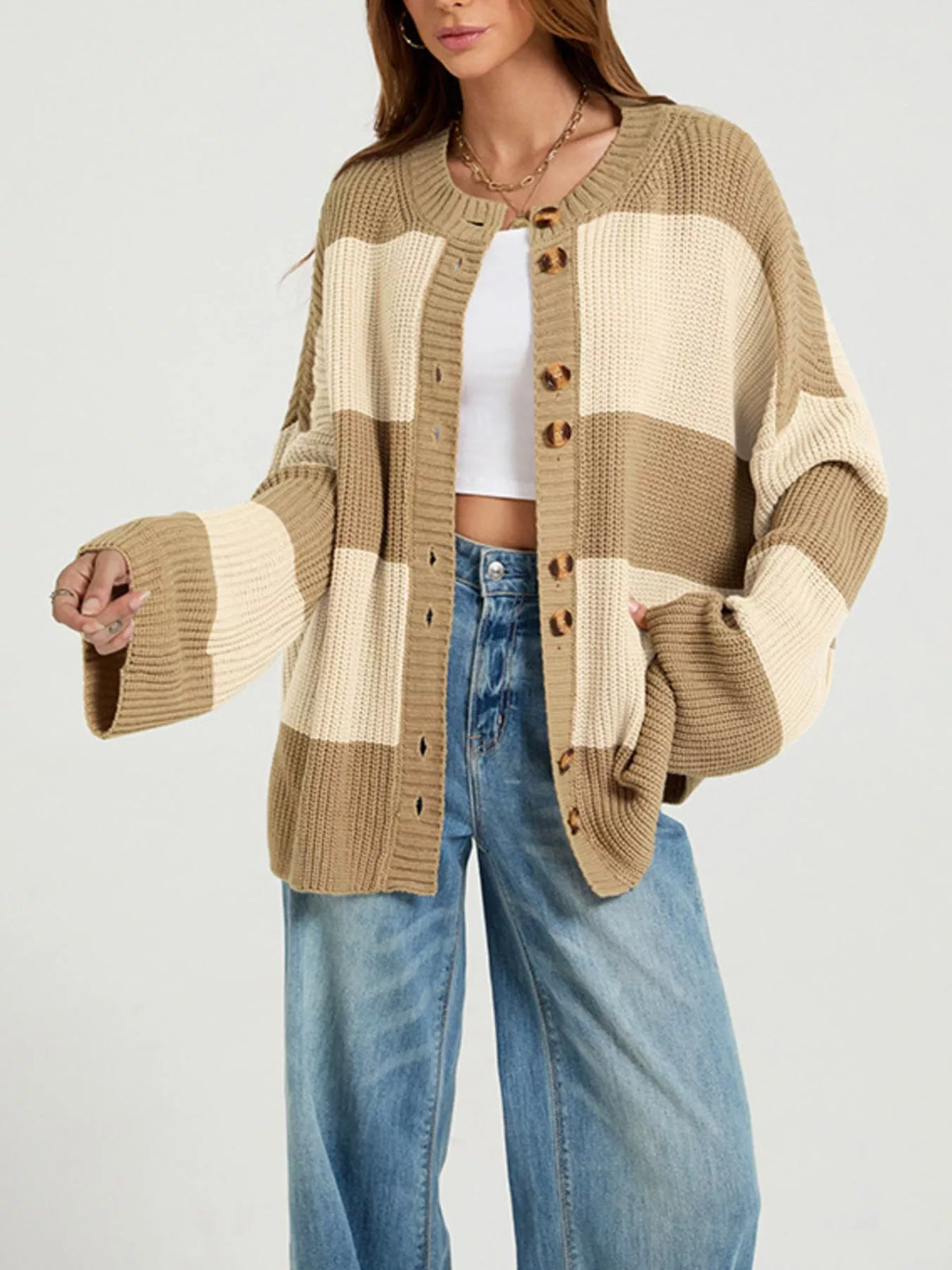 Color block striped button-up cardigan by Trendsi, featuring vibrant color contrasts and a classic knit design.