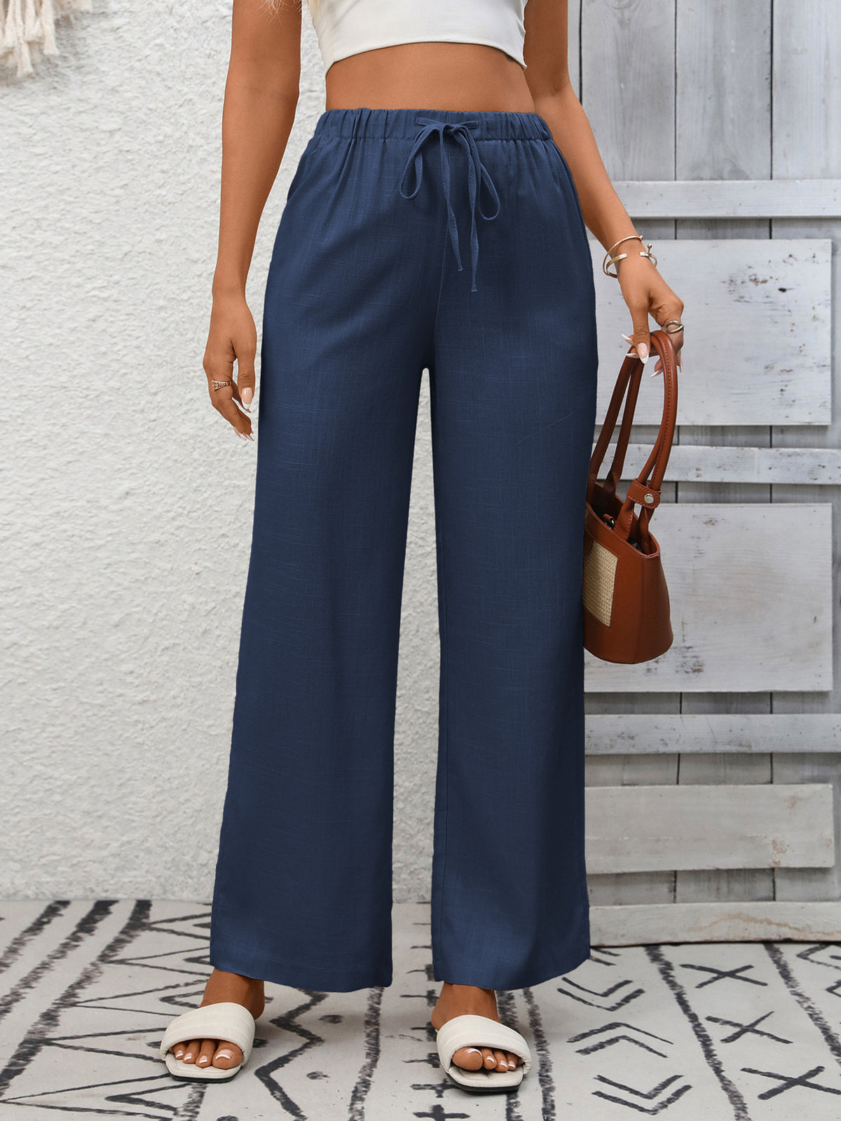 Women's high-waisted wide-leg drawstring pants in soft, breathable viscose fabric from Plush Fashion Hub.
