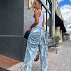 Eprolo high-waist pleated brushed edge straight leg jeans hanging on a rack, showcasing their stylish design and fit.