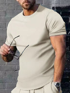 Plus size men's casual T-shirt by Trendsi in solid color, featuring a comfortable fit and classic crew neckline.