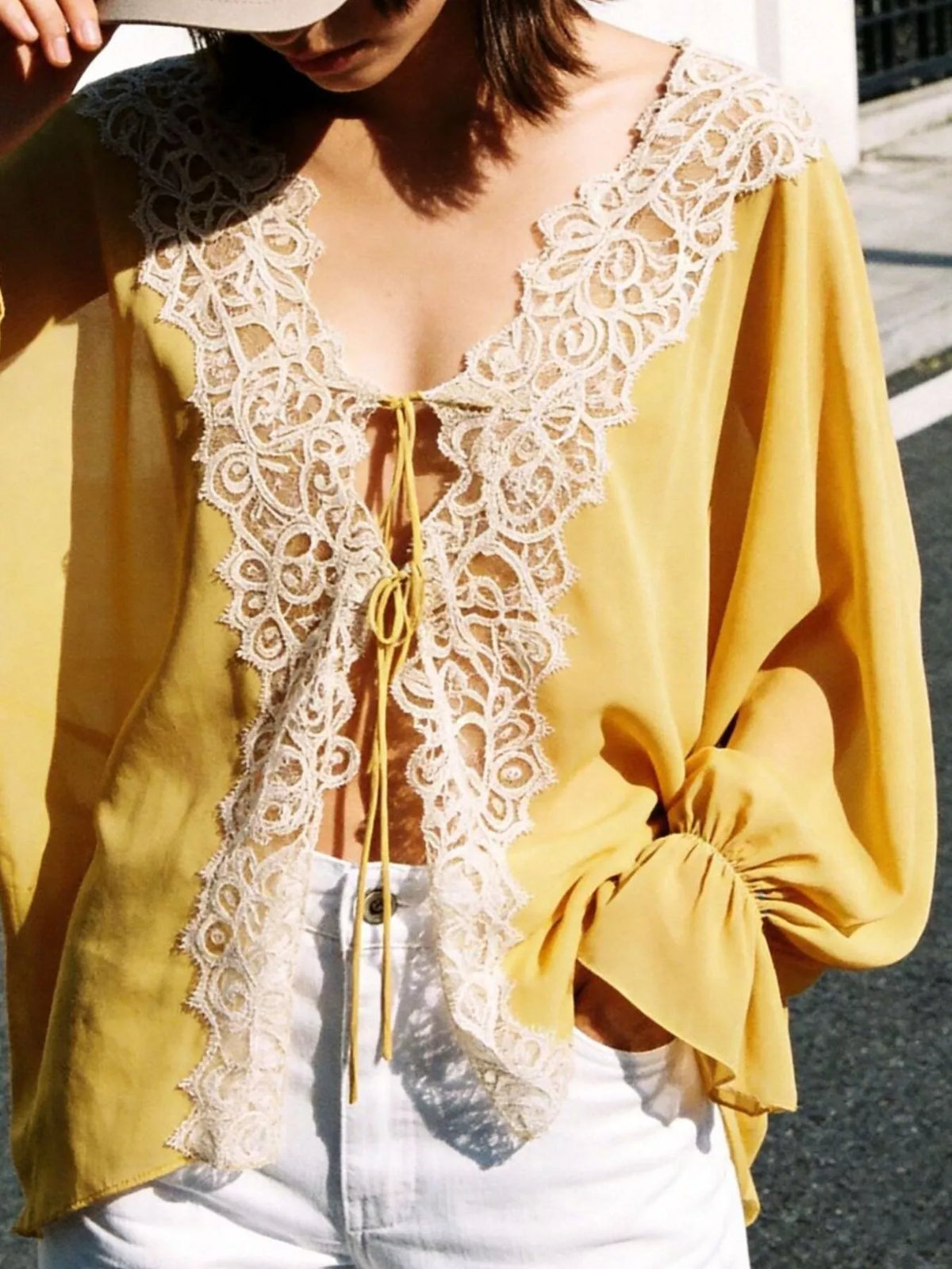 Sheer lace-trimmed front tie blouse for women, featuring delicate lace details and a relaxed fit, stylish and elegant.