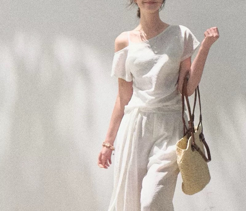 Linen off-shoulder asymmetric casual set by FitiqueFit in two colors, featuring relaxed fit top and matching pants for comfortable style.