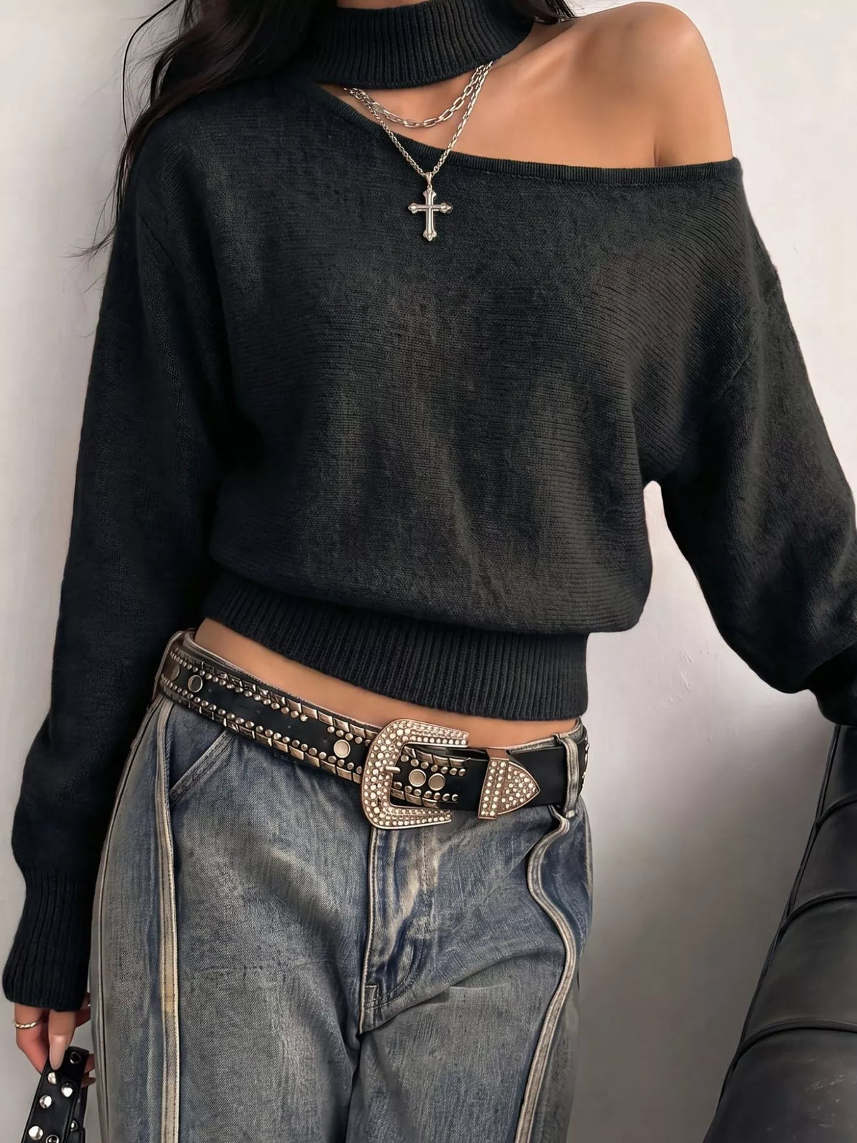 Cold-shoulder dropped shoulder sweater from Trendsi in soft knit fabric, featuring a relaxed fit and stylish cut-out shoulder design.