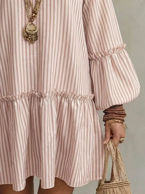 Full size striped balloon sleeve mini dress by Trendsi, featuring bold stripes and a relaxed fit with stylish balloon sleeves.