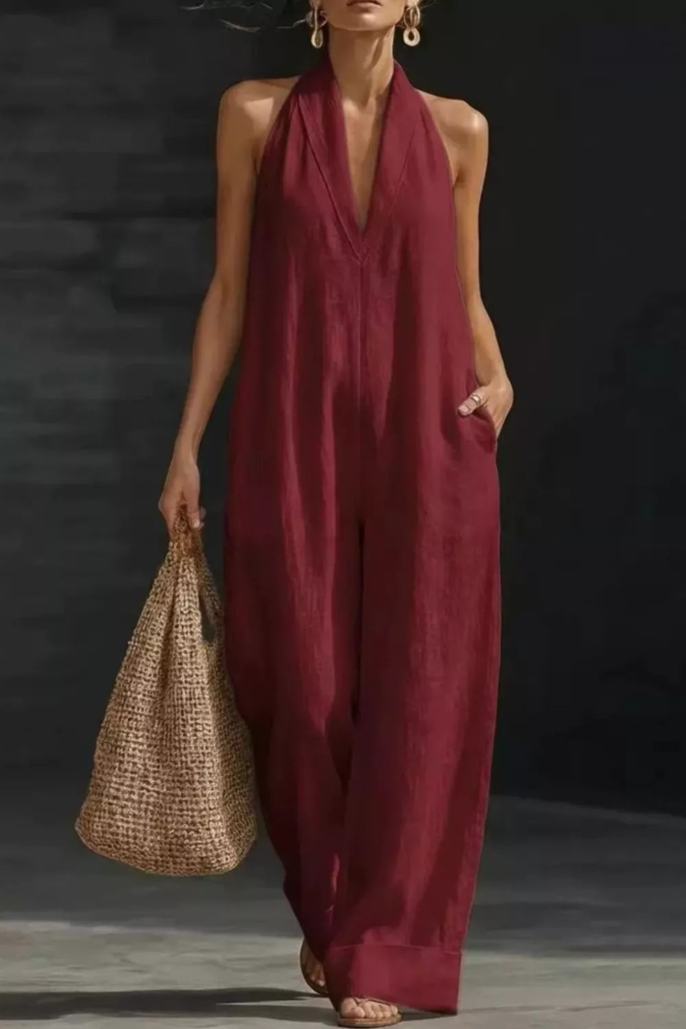 Women's sleeveless wide-leg jumpsuit with pockets, casual romper by Plush Fashion Hub, shown in a stylish, relaxed fit.