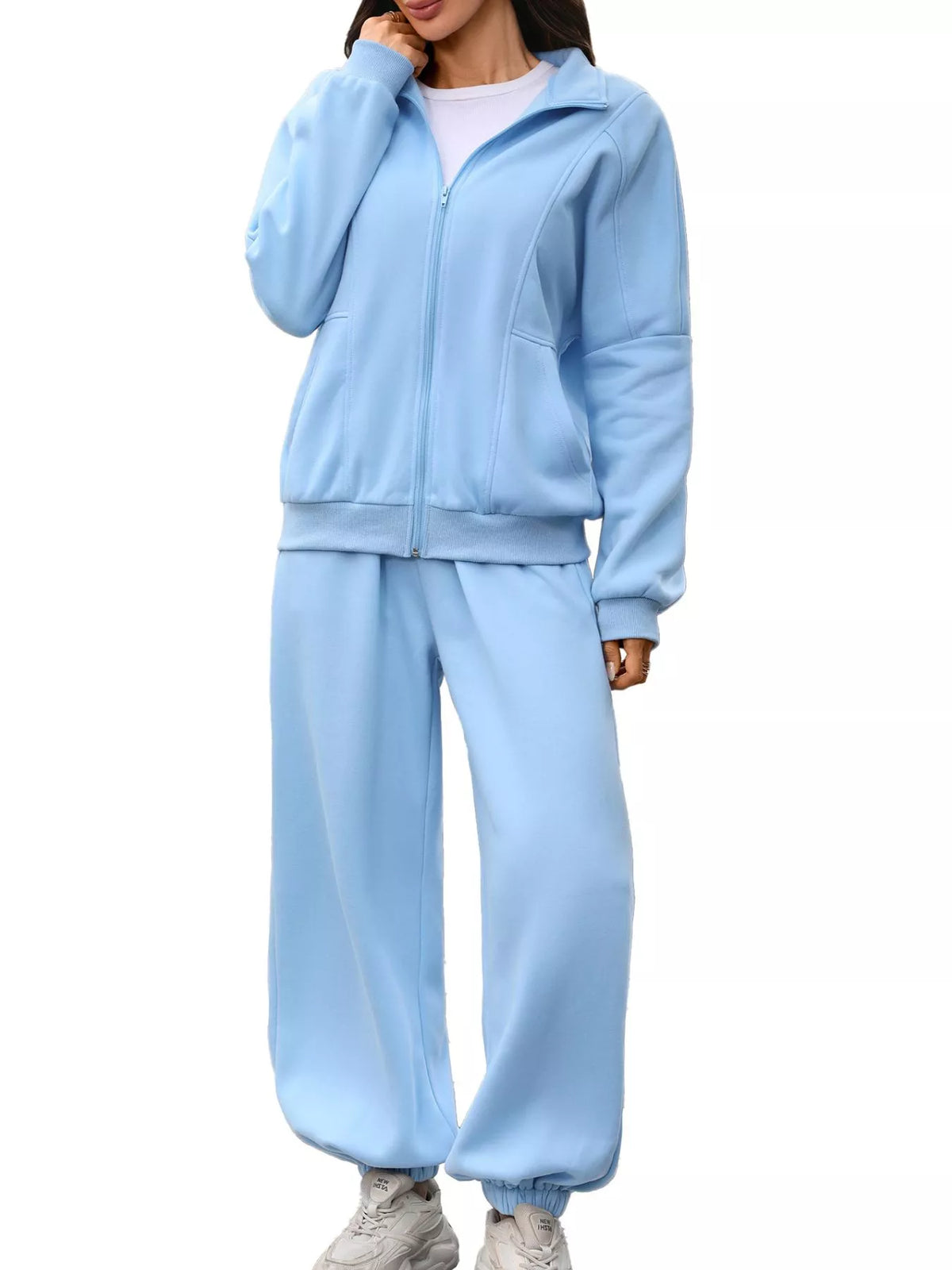 Women's zip-up long sleeve top and pants set by Trendsi, featuring a coordinated casual outfit with a comfortable fit.