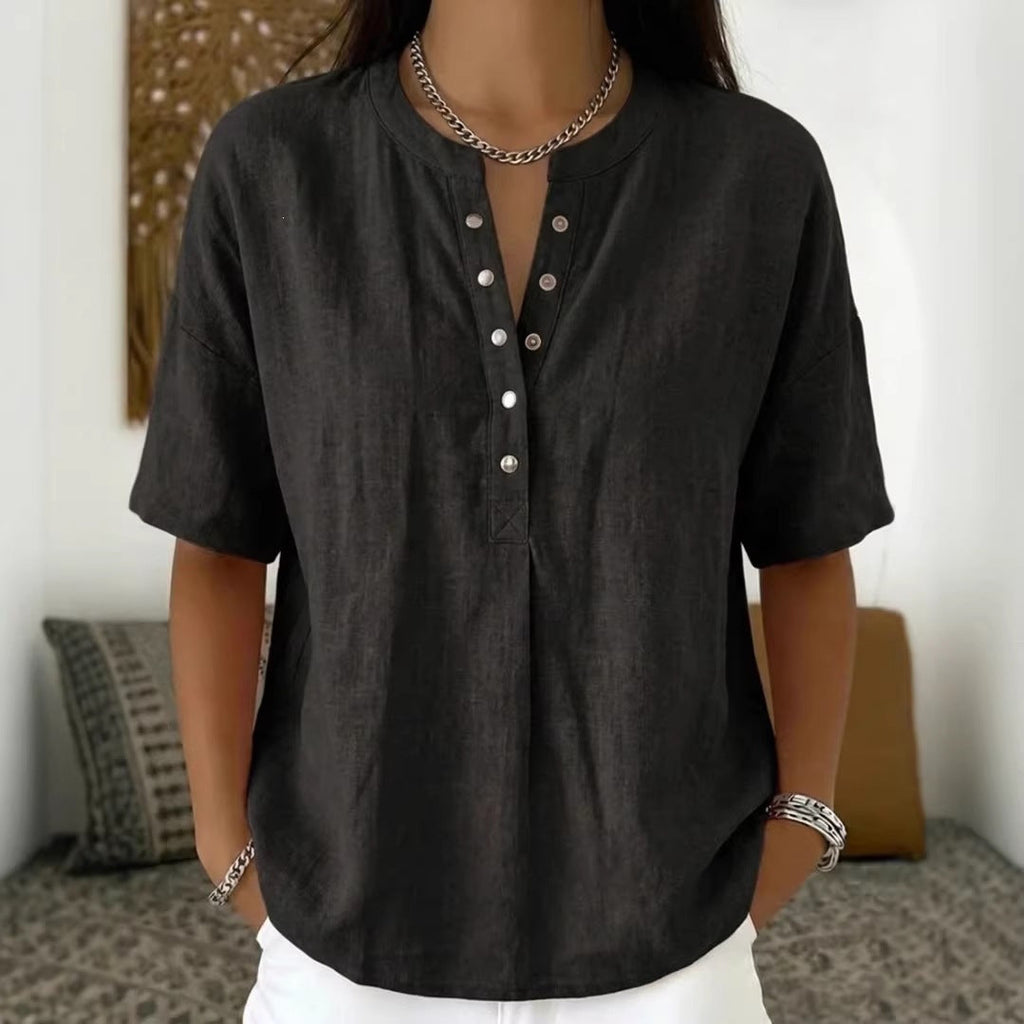 Women's solid color loose-fit short-sleeve pullover top by FitiqueFit, casualwear style, shown in a relaxed fit on a model.