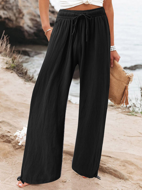 Plus size full-size drawstring wide leg pants by Trendsi, shown front view with relaxed fit and casual style.