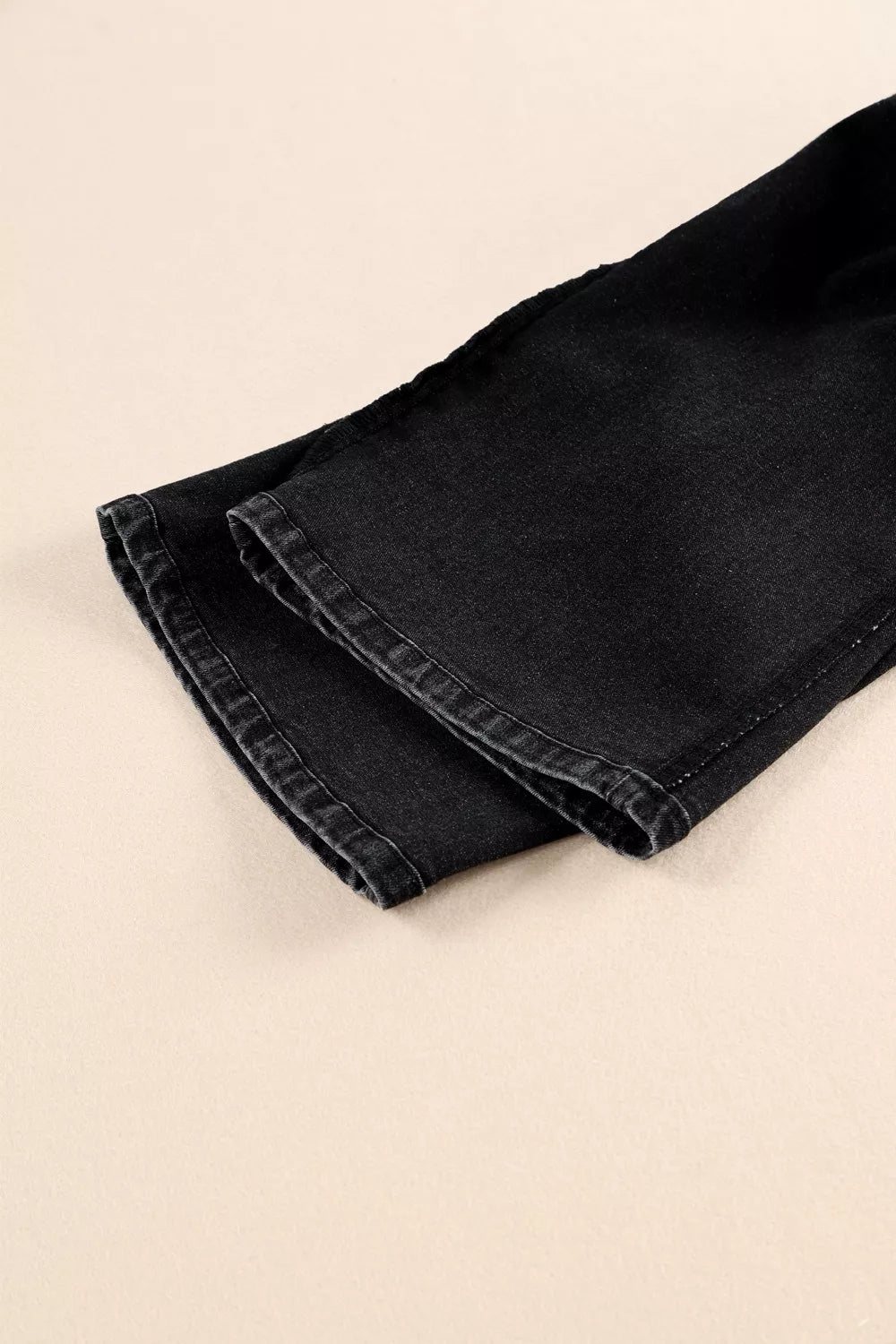 Plush Fashion Hub high-waisted wide-leg jeans with button-fly closure, showcasing denim fabric and relaxed fit style.